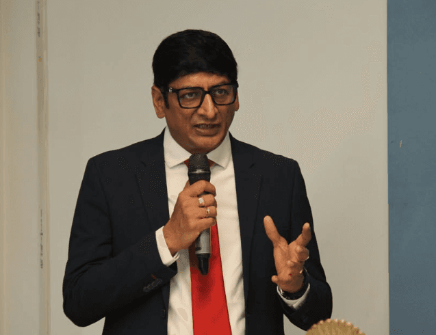 Keynote speaker delivering an address at a DCC event at Bennett University